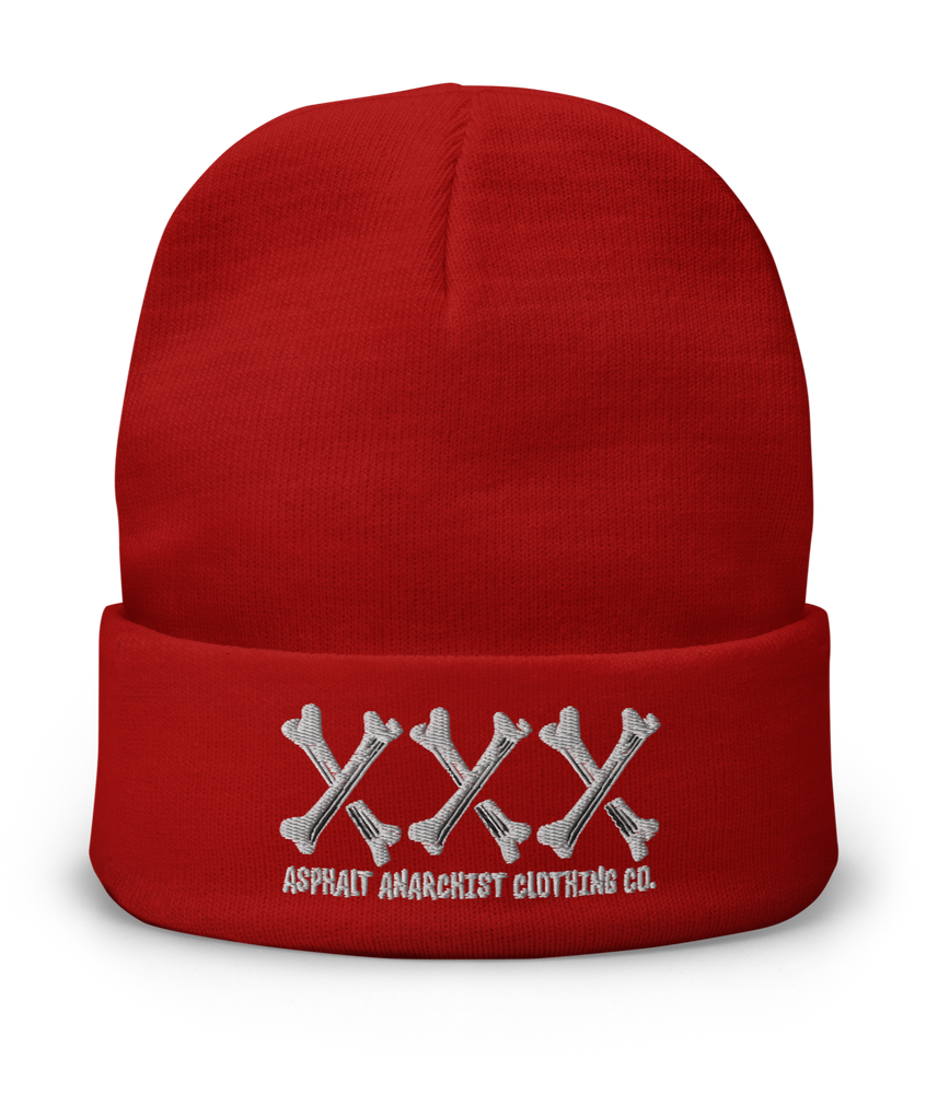 
                  
                    Front view of the Bone Grinder X-Bone Beanie in red from Asphalt Anarchist—embroidered triple X’s in bone font with stitched brand detail. Misfit headwear. AI-generated image.
                  
                