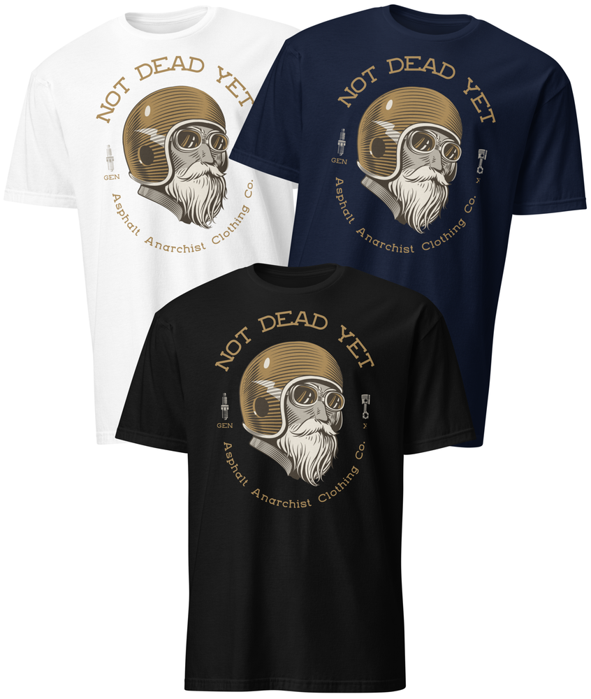 Front view of black, white, & navy t-shirts featuring bold ‘Not Dead Yet’ graphic with vintage lowbrow skull art and distressed lettering in a rebellious, hot rod style. Asphalt Anarchist Clothing Co. OLD SKOOL HOT ROD APPAREL Custom fueled, never factory filled. Image is AI-generated.
