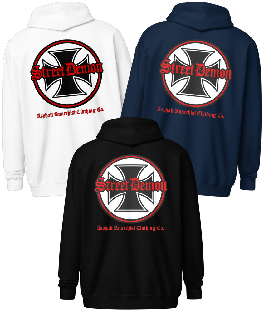 
                  
                    Back View. Street Demon Heavy Zipper Black, white, navy color options Hoodie with bold Old English typography layered over a classic iron cross emblem. The design channels raw hot rod energy and outlaw attitude, printed on rugged fleece with a durable metal zipper for a rebellious finish. This image was generated by AI 
                  
                